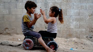 Palestinian children play outside their family house in Gaza City August 1, 2022. (Reuters)