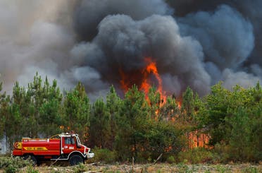 A firefighting truck works to contain a fire in Saint-Magne, as wildfires continue to spread in the Gironde region of southwestern France, August 11, 2022. (File photo: Reuters)