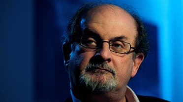 FILE PHOTO: British author Salman Rushdie listens during an interview with Reuters in London April 15, 2008. REUTERS/Dylan Martinez/File Photo