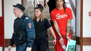 FILE - WNBA star and two-time Olympic gold medalist Brittney Griner is escorted to a courtroom for a hearing in Khimki just outside Moscow, Russia, Thursday, July 7, 2022. Viktor Bout, the Russian arms dealer who once inspired a Hollywood movie, is back in the headlines with speculation around a return to Moscow in a prisoner exchange for WBNA star Griner and former Marine Paul Whelan. (AP Photo/Alexander Zemlianichenko, File)