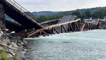 A wood and steel bridge over a river collapsed in southern Norway on Monday as a car and a truck were crossing. Police said they had rescued both drivers, August 15, 2022. (Twitter)
