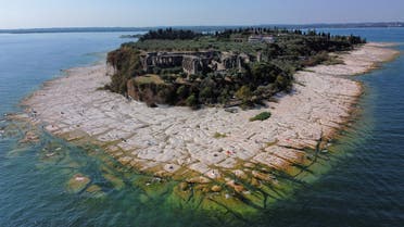 Underwater rocks emerge from the water of Lake Garda after northern Italy experienced the worst drought in 70 years in Sirmione, Italy, August 16, 2022. (Reuters)