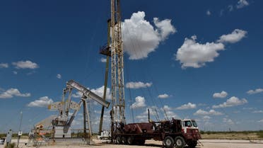 A work-over rig performs maintenance on an oil well in the Permian Basin oil production area near Wink, Texas, US. (File photo: Reuters)