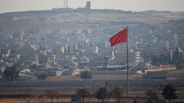 A view of the Syrian town of Kobani is pictured from the Turkish border town of Suruc, in Sanliurfa province, Turkey, October 31, 2019. REUTERS/Kemal Aslan
