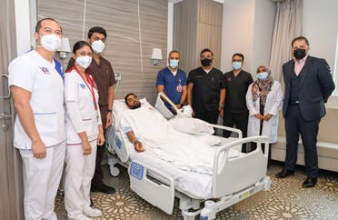 Patient Mohamed Mansour Mohamed with the medical team who treated him. (Supplied)