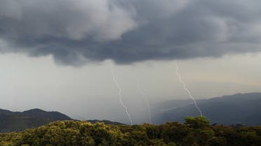 This picture taken on August 11, 2022, shows lightning bolts during a storm over the Taravo valley, as the French Mediterranean island of Corsica is under storm warning. (AFP)