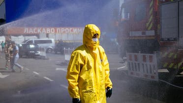 A Ukrainian emergency ministry rescuer attends an exercise in the city of Zaporizhzhia on August 17, 2022, in case of a possible nuclear incident at the Zaporizhzhia nuclear power plant located near the city. (AFP)