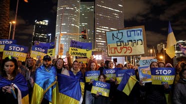 Protestors hold signs at a demonstration against the Russian military invasion into Ukraine, calling on Russian President Vladimir Putin to stop the war, in Tel Aviv, Israel March 12, 2022. (File photo: Reuters)