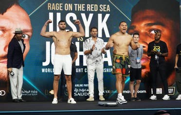 Filip Hrgovic (left) and Zhang Zhilei pose at Jeddah's King Abdullah Sports City on August 19, 2022, ahead of their match on August 20.