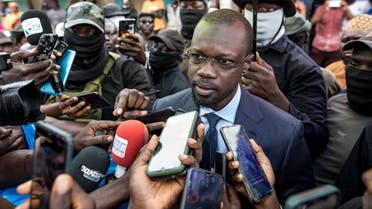 Ousmane Sonko(C), President of the opposition party Senegalese Patriots for Work, Ethics and Brotherhood (PASTEF), gives a press statement at the HLM basic school in Ziguinchor on July 3, 2022. (AFP)