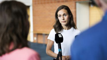 Finland's Prime Minister Sanna Marin speaks with members of the media in Kuopio, Finland August 18, 2022. (Reuters)