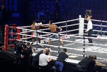 Traycho Georgiev (right) aims a punch at Rashed Belhasa (left) during their boxing match on the undercard of the Rage on the Red Sea event in Jeddah's King Abdullah Sports City on August 20, 2022. 