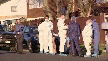 In this still image taken from video, police and forensic investigators gather at the scene where suitcases with the remains of two children were found, in Auckland, New Zealand, August 11, 2022. (Reuters) 
