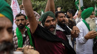 Farmers break barricades, shout slogans against Modi as protests return to New Delhi