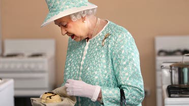 Britain's Queen Elizabeth II looks at samples of food prepared by students at Clontarf Aboriginal College in Perth, Australia, Thursday, Oct. 27, 2011. The queen is in Australia for an official visit and to attend the Commonwealth Heads of Government Meeting. (AP Photo/Sharon Smith, Pool)