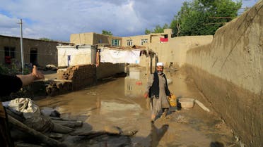 An Afghan man cleans up his damaged home after the heavy flood in the Khushi district of Logar, Afghanistan, August 21, 2022. (Reuters)