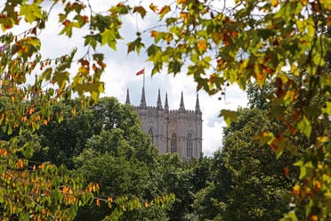 Brown leaves are seen on the branches of trees in St James' Park in London, August 24, 2022. (AFP)