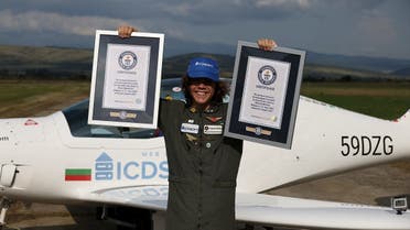 Mack Rutherford poses with Guiness World Record certificates after his arrival at an airport near Radomir, Bulgaria, on August 24, 2022. (Reuters)