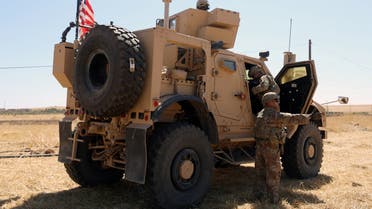 An American flag flutters on a U.S military vehicle during a joint U.S.-Turkey patrol, near Tel Abyad, Syria September 8, 2019. REUTERS/Rodi Said
