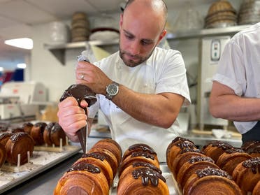 Lafayette Grand Cafe & Bakery executive pastry chef Scott Cioe works on the preparation of Supremes, at Lafayette Grand Cafe & Bakery, in New York, US, on August 24, 2022. (Reuters)