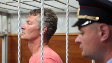 Russian opposition politician Yevgeny Roizman, detained and being investigated for criticizing Russia's involvement in the military conflict in Ukraine, stands inside a defendants' cage as he attends a court hearing in Yekaterinburg, Russia August 25, 2022. (Reuters)