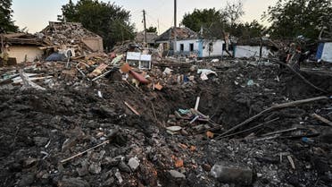People stand next to a residential house destroyed by a Russian military strike, as Russia's attack on Ukraine continues, in Chaplyne, Dnipropetrovsk region, Ukraine August 24, 2022. (Reuters)