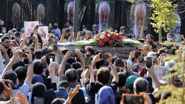 Iranians attend a funeral ceremony for prominent Iranian famous poet Amir Hushang Ebtehaj, also known by his pen name H.E.Sayeh, outside the Vahdat hall in Tehran, on August 26 2022. (AFP)