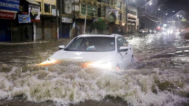  A vehicle drives along a flooded street, following heavy rains during the monsoon season in Karachi, Pakistan July 24, 2022. (Reuters)