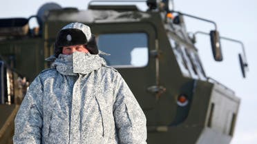 A Russian serviceman stands in front of an off-road military vehicle at the Nagurskoye military base in Alexandra Land on the remote Arctic islands of Franz Josef Land, Russia March 29, 2017. (File photo: Reuters)