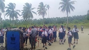School students and staff gather in an open area after a magnitude 6.1 earthquake struck near Mentawai Islands, in South Nias, North Sumatra, Indonesia, August 29, 2022 in this screen grab obtained from a social media video. (Reuters)