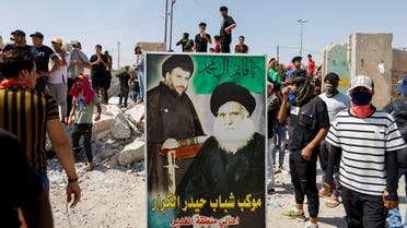 Followers of Iraqi Shia cleric Muqtada al-Sadr withdraw from the streets after violent clashes, near the Green Zone in Baghdad, Iraq, August 30, 2022. (Reuters)