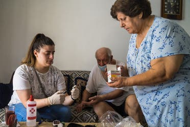 In their home in Ashrafiyeh, Habib Copti, and Elham Copti receive treatment for their diabetes. (Photo: Clément Gibon)