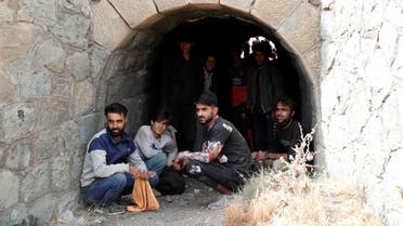 Afghan migrants hide from security forces in a tunnel under train tracks after crossing illegally into Turkey from Iran, near Tatvan in Bitlis province, Turkey August 23, 2021. (Reuters)