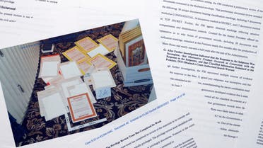 This image contained in a court filing by the Department of Justice on Aug. 30, 2022, and redacted by in part by the FBI, shows a photo of documents seized during the Aug. 8 search by the FBI of former President Donald Trump's Mar-a-Lago estate in Florida. The Justice Department says it has uncovered efforts to obstruct its investigation into the discovery of classified records at former President Donald Trump's Florida estate. (Department of Justice via AP)