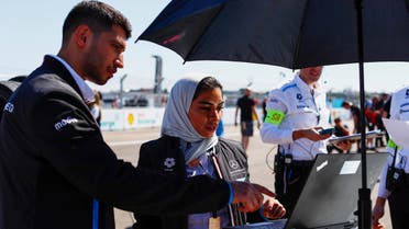 Left to right: Ahmed al-Hussain and Duaa al-Zaher, NEOM graduates during their placement with the Mercedes EQ Formula E team. (Supplied)