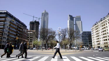 Pedestrians cross the street at Buenos Aires' Puerto Madero neighborhood in this picture taken October 5, 2005. (File photo: Reuters)
