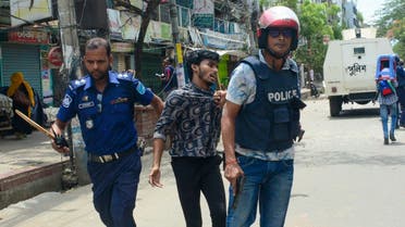 Members of Bangladesh police personnel detain an activist and supporter of Bangladesh Nationalist Party (BNP) during a rally in Narayanganj on September 1, 2022. (AFP)