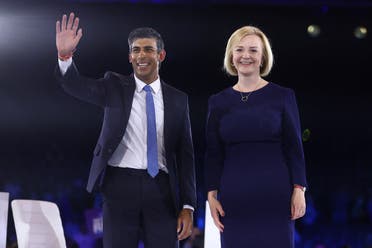 Conservative leadership candidates Liz Truss and Rishi Sunak stand together as they attend a hustings event, part of the Conservative party leadership campaign, in London, Britain on August 31, 2022. (Reuters)