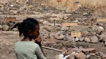 A young woman at mass graves in the Abune Aregawi Ethiopian Orthodox Church cemetery, in the town of Mai Kadra, Ethiopia, March 5, 2021. (File photo: Reuters)