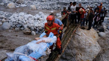 Rescue workers carry an injured victim on a stretcher following a 6.8-magnitude earthquake in Qinggangping village, Luding county, Ganzi Tibetan Autonomous Prefecture, Sichuan province, China September 5, 2022. (Reuters)