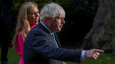 Outgoing British Prime Minister Boris Johnson, with his wife Carrie Johnson, leaves after delivering a speech on his last day in office, outside Downing Street, in London, Britain, on September 6, 2022. (Reuters)
