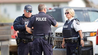 Royal Canadian Mounted Police (RCMP) officers at James Smith Cree Nation talk after multiple people were killed and injured in a stabbing spree on the reserve and nearby town of Weldon, Saskatchewan, Canada September 5, 2022. (Reuters)