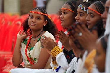 Ethiopian youth, wearing headbands in the colors of Tigray’s flag, take part in the Ashenda celebrations at al-Qurashi park in the Sudanese capital Khartoum, on August 26, 2022. (AFP)