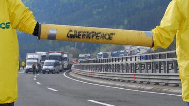 Greenpeace activists block a road. (File photo: Reuters)