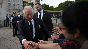 Britain’s King Charles greets well-wishers outside Buckingham Palace