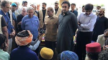 United Nations Secretary General Antonio Guterres (L), Pakistan’s Prime Minister Shehbaz Sharif (C) and Foreign Minister Bilawal Bhutto Zardari (R) meet internally displaced flood-affected people at a hospital during their visit to Larkana, Sindh province on September 10, 2022. (AFP)