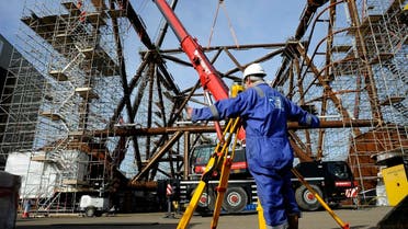 A surveyor checks part of the jacket section of Centrica’s York platform at the Heerema plant in Hartlepool, northern England, on March 6, 2012. (Reuters)