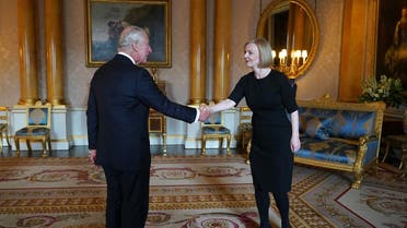 Britain’s King Charles III (L) greets Britain’s Prime Minister Liz Truss (R) during their first meeting at Buckingham Palace in London on September 9, 2022. (AFP)