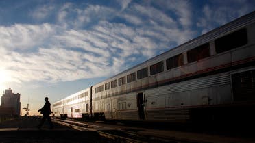 An Amtrak train attendant walks across the tracks at the Holdrege station after exiting the 5 California Zephyr Amtrak train in Holdrege, Nebraska June 13, 2008. (Reuters)