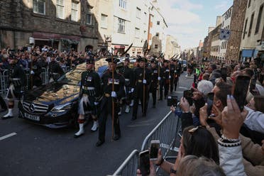 The hearse carrying the coffin of Britain's Queen Elizabeth travels on the Royal Mile in Edinburgh, Scotland, Britain, on September 12, 2022. (Reuters)
